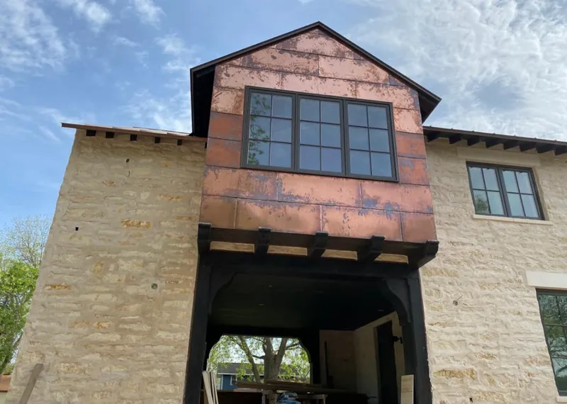 Copper metal panel facade on a stone building for Skylight Installation in La CaÃ±ada Flintridge